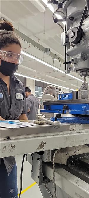 A student works with machinery